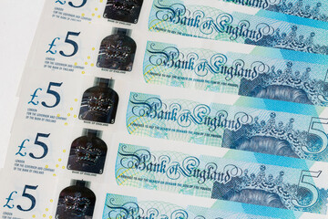 British five pound banknote. Designed to deter counterfeiting - the note has a hologram, is polymer...