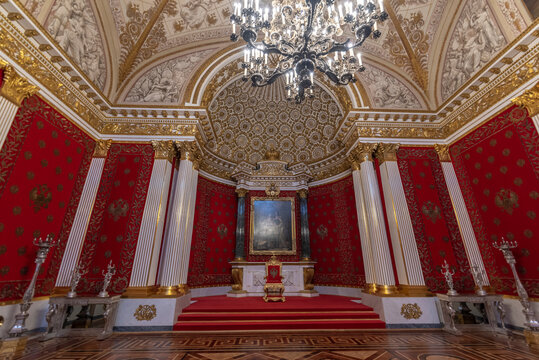 Saint Petersburg, Russia - 11 December, 2019: Interior of the Hermitage Russian state museum. Amazing room, walls and ceiling decorated with baroque gold ornaments. Largest in the world