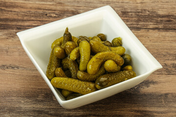 Pickled gherkin in the bowl