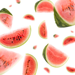Many watermelon slices freefalling on white background. Selective focus - shallow depth of field.