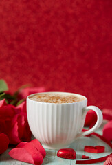 cup of coffee and hearts on light surface