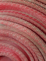 Twisted red fire hose.