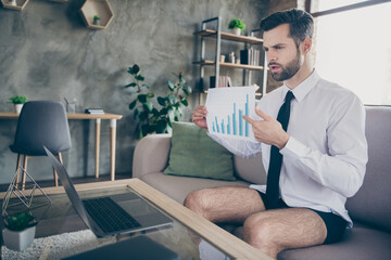 Portrait of his he nice attractive confident successful brunet guy attending online meeting briefing presentation strategy data analysis at modern loft industrial style interior living-room apartment