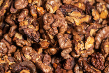 Dry walnut. Closeup of big shelled walnuts pile. Nuts background