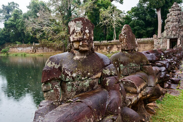 Fototapeta na wymiar Asura Statues of the Nagas Bridge in Preah Khan temple, in Angkor Thom, Siem Reap, Cambodia
