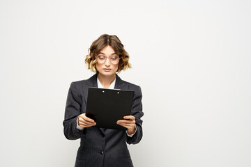 Naklejka premium Woman in business suit finances work documents glasses hairstyle