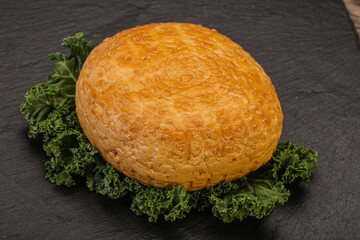 Smoked Georgian suluguni cheese piece