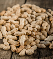 Dried peanuts closeup photo. Peanut in the shell. Food background of peanuts, healthy vegan food