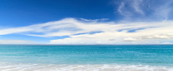 Fototapeta na wymiar Sand beach and blue ocean