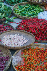a lot of fresh vegetables are being sold at the market, food ingredients at street/traditional market. top view.