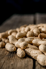 Dried peanuts closeup photo. Peanut in the shell. Food background of peanuts, healthy vegan food