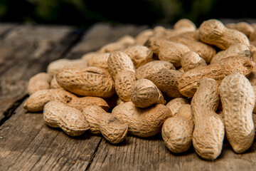 Dried peanuts closeup photo. Peanut in the shell. Food background of peanuts, healthy vegan food