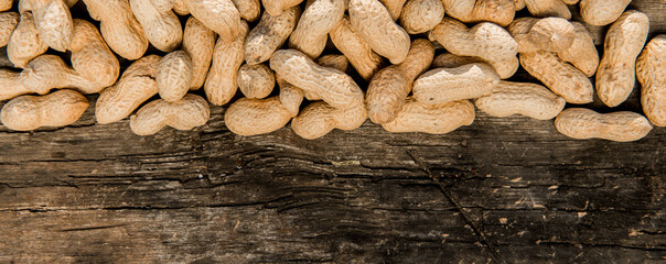 Dried peanuts closeup photo. Peanut in the shell. Food background of peanuts, healthy vegan food