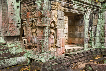 statue of a Devata deities with an enigmatic smile in Preah Khan temple, in Angkor Thom in Siem Reap Cambodia