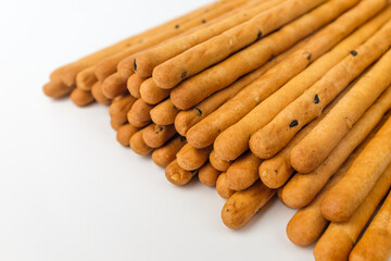 Sesame sticks on white background