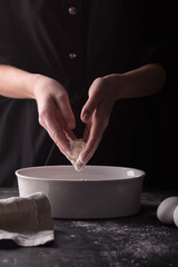 Woman preparing the dough for a birthday cake