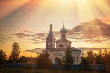orthodox old church in the village at sunset