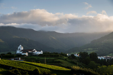 A small village on a hilltop at sunrise
