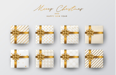 Christmas banner or poster design. Xmas gift boxes. Winter celebration concept. Golden ribbon and bow on white wrapping paper. Realistic vector illustration.
