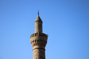 Fototapeta na wymiar minaret image of a historical mosque, natural stone and inlaid