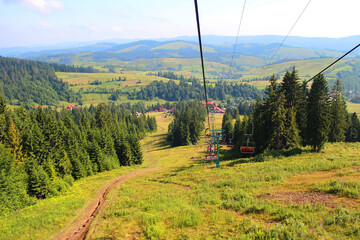 Ski lift that takes tourists and skiers to the top of the Borzhava ridge in Carpathian mountains, Transcarpathia, Western Ukraine. Amazing vacation in the Ukrainian mountains. Mountainous countryside