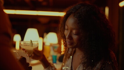African woman dancing in restaurant. Beautiful lady having rest in nightclub