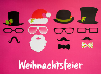 German Text Weihnachtsfeier Means Christmas Party. Santa Claus Mask And Three Cartoon Mask With Hat, Glasses And Bows With Christmas Decoration. Pink Paper Background