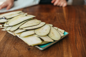Sliced eggplant on a plate in the kitchen