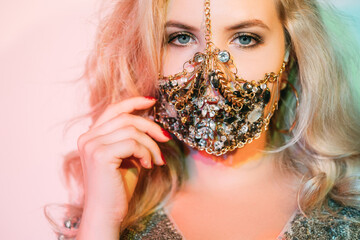 Covid-19 fashion. Quarantine accessory. Festive look. Portrait of sensual blonde woman in luxury...