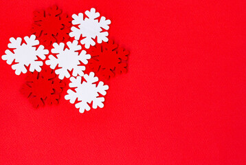 red and white snowflakes on a red background. Christmas mood