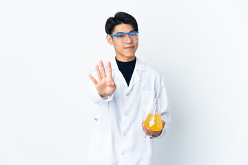 Young Chinese scientific man isolated on white background happy and counting four with fingers