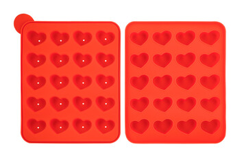 Heart shaped red silicone form isolated on white background. Lollipop silicone mold, bakeware. Top iew, flat lay