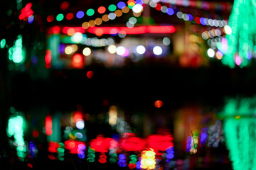 Fototapeta na wymiar Bokeh background from the lights in the night market
