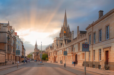 View of High Street road with Cityscape of Oxford at sunset - St Mary's University Church