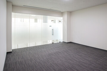 bright empty room with gray carpet on floor