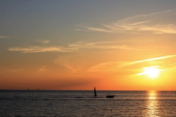Fototapeta na wymiar boat sailing in the black sea at beautiful sunset