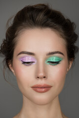 Portrait of a girl with bright colored eye makeup