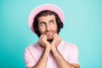 Photo portrait of curious cunning man wearing hat thinking touching chin looking at blank space...