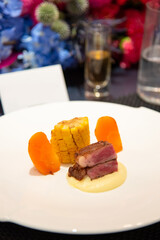 fine sliced of beef steak on plate on fine dining table