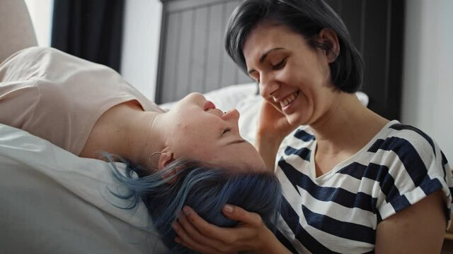 Video of affectionate lesbian kissing her girlfriend in the forehead. Shot with RED helium camera in 8K.
