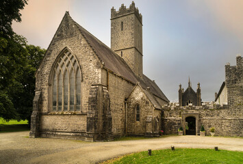 Fototapeta na wymiar Frontal view at sunset of the Augustinian Abbey near the village of Adare in Ireland.