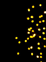 Fototapeta na wymiar The golden side's or boke on a black background. Merry Christmas and happy New Year. Christmas background.