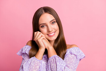 Photo of adorable lovely teen girl wear casual purple outfit hands cheek isolated pastel pink color background