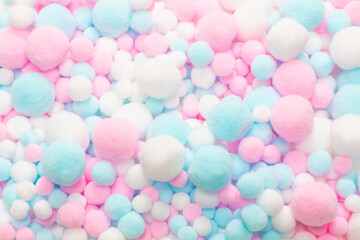 Fototapeta na wymiar White, pink and blue soft pompons