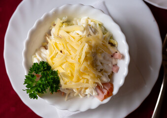 traditional Belarusian salad of vegetables, bacon, cheese, and greens. Polessky salad