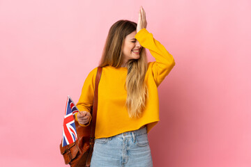 Young blonde woman holding an United Kingdom flag isolated on white background has realized something and intending the solution