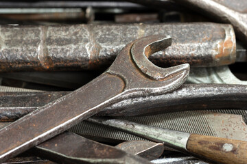 A box with a set of old rusty locksmith tools.