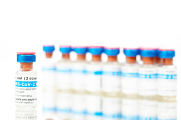 Bottles of new SARS-CoV-2 vaccine on table ready for application