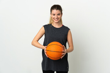 Young blonde woman isolated on white background playing basketball