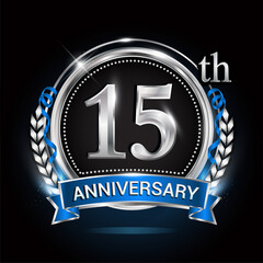 15th silver anniversary logo with blue ribbon and ring.
